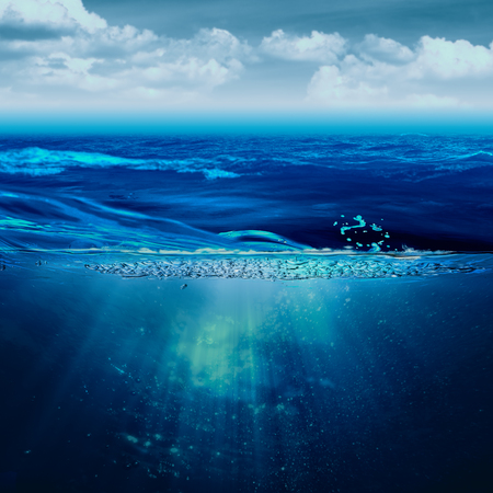 Abstract marine backgrounds with stormy ocean and underwater viewの写真素材