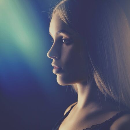 Dramatic female portrait with beauty lens flareの写真素材
