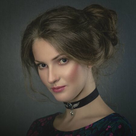 Grungy female portrait. Retro styled classic dramatic lightの写真素材