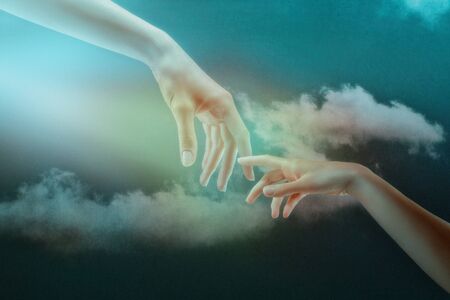 Humanity. Abstract backgrounds. Couple of hands against the skies