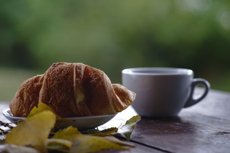 Early morning. Cup of fresh delicious coffee on the tableの写真素材