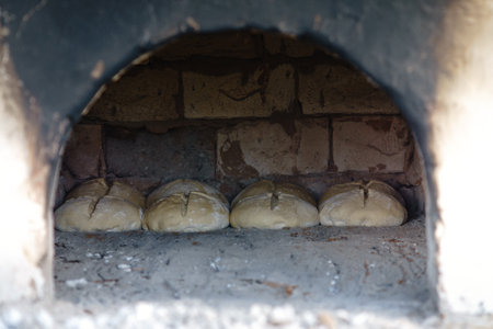 Rural oven with dough ready for bakingの写真素材
