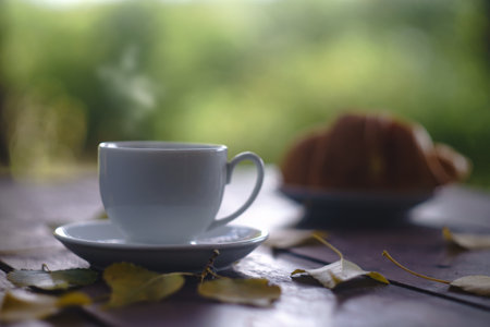Early morning. Cup of fresh delicious coffee on the tableの写真素材