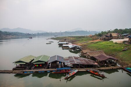 Homes in river at Sangklaburi, Thailandの写真素材