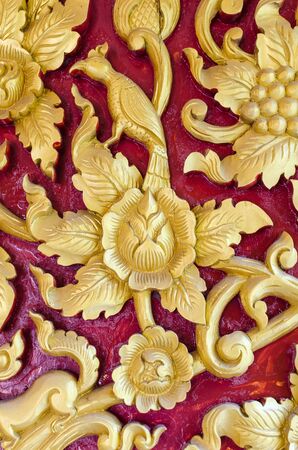 Thai stye carving texture in buddish church s wallの写真素材