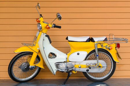 Classics motorcycle with the orenge wall background