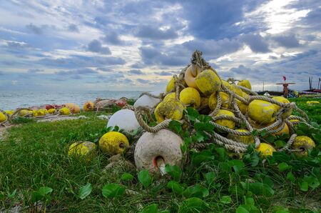 Yellow Lobster Buoys on the beach, Thailand