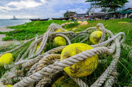 Yellow Lobster Buoys on the beach, Thailandの写真素材
