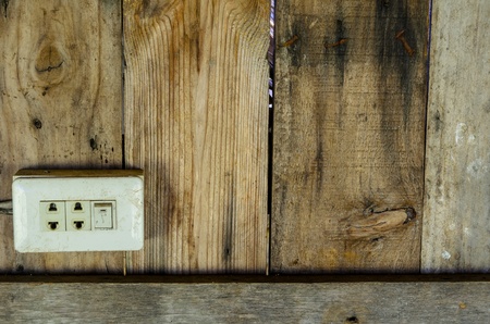 Old electrical switch on old wood backgroundの写真素材
