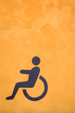 Toilet sign painting on the orenge color backgroundの写真素材