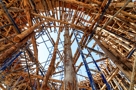 Wood scaffolding in the construction site with blue sky の写真素材