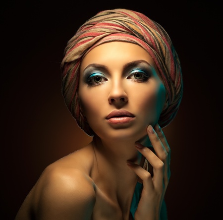 Beautiful woman on dark brown background  Fashion art photo  Close-up makeupの写真素材