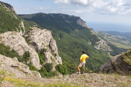 Man walking in the mountainsの写真素材