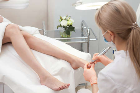 Pedicure in a Day Spa, feet nails get cut and filedの写真素材
