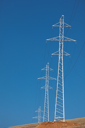 Pylon and transmission power line in sunset