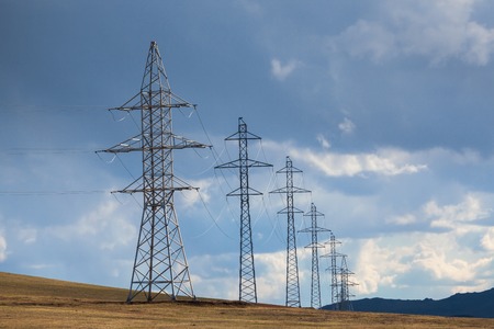 Pylon and transmission power line in sunset