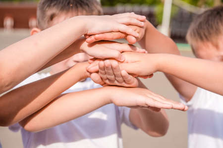 Friends athletes colleagues hand uniteの写真素材