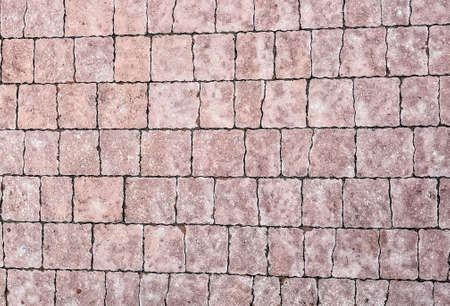 A wall of tiles. Brick wall. Background for photography. Old wall background. Textureの写真素材