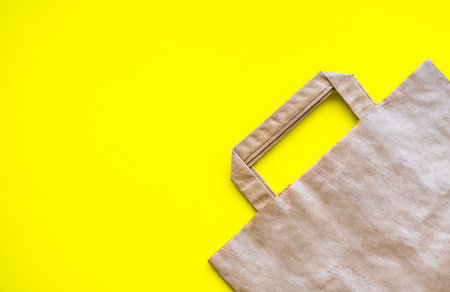 Eco grocery bag on a yellow backgroundの写真素材