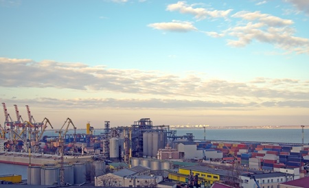 Cranes and containers at a port in the late afternoon periodの写真素材
