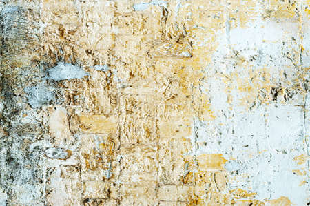 texture of shabby paint and plaster cracks backgroundの写真素材