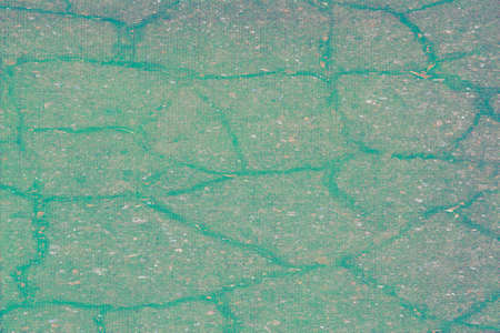 Asphalt has many cracks in different directionsの写真素材