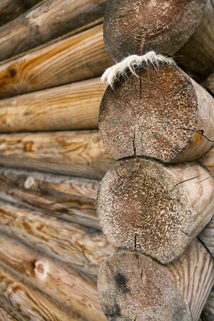 Selective focus is on the end of a log constructionの写真素材
