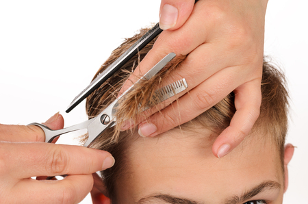 Young men at professional barber, hair saloonの写真素材