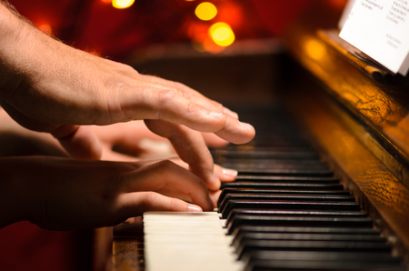 Learn to play piano, hands detailの写真素材