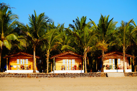 Cozy private resort (bungalows) on the beach, Agonda beach, South Goa. Colorful beach huts.の写真素材