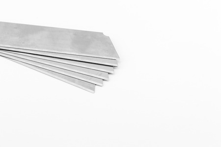 Blades of office knife isolated on white backgroundの写真素材