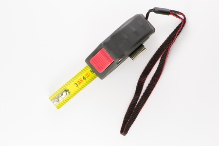 Construction measuring tape on a white backgroundの写真素材