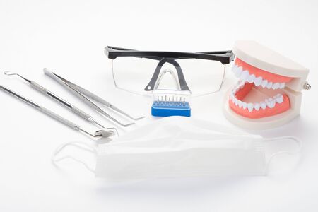 Modern dental office tools on a white backgroundの写真素材