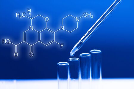 Dosage in laboratory blue lightの写真素材