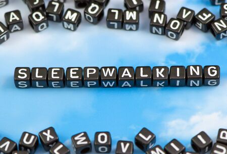 The word sleepwalking on the sky backgroundの写真素材