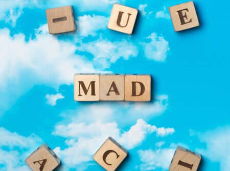 The word mad on the sky backgroundの写真素材