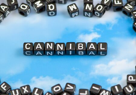 The word Cannibal on the sky backgroundの写真素材