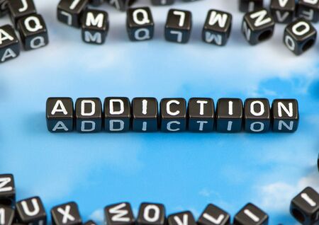 The word Addiction on the sky backgroundの写真素材