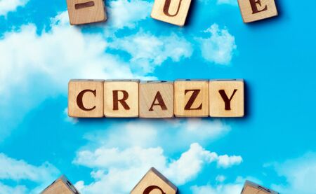 The word Crazy on the sky backgroundの写真素材