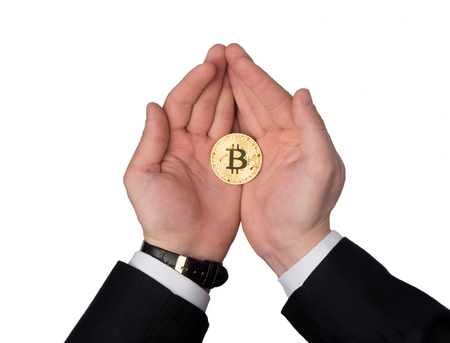 Bitcoin holds in the palmsの写真素材