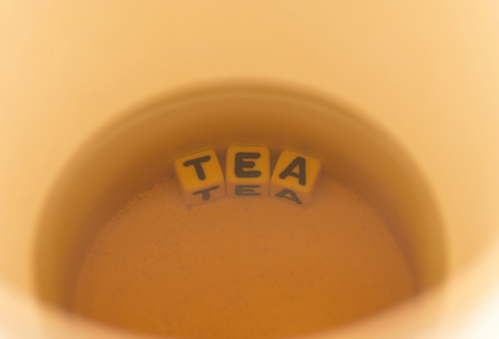 The word tea at the bottom of the mugの写真素材
