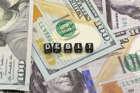 The word on the background of dollars debtの写真素材