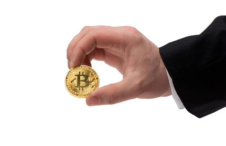 The concept of Bitcoin on a white background in a handの写真素材