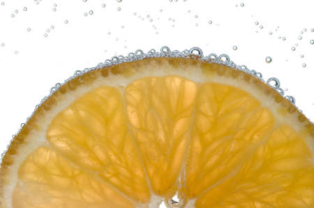 Slice of lemon with bubblesの写真素材