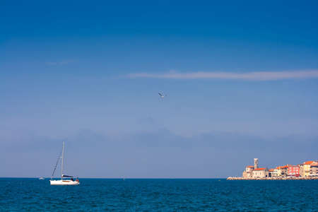 Boat leaving harbour (Piran, Slovenia)の写真素材