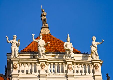 Statues on a house in Gdansk, Pomerania, Poland.の写真素材