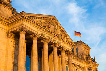 Reichstag- the building of the German parliament (Bundestag) in late afternoon sunlightの写真素材