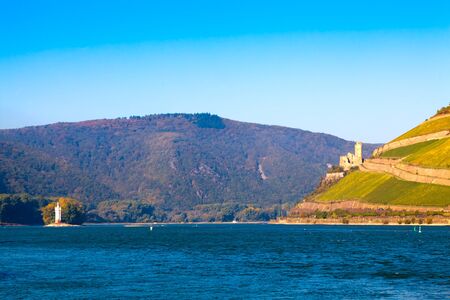 The Rhine near Bingen, Germany. Part of the UNESCO World Heritage Site- Upper Middle Rhine Valley. On the left the Mouse Tower, on the right the castle Burg Ehrenfels.のeditorial素材