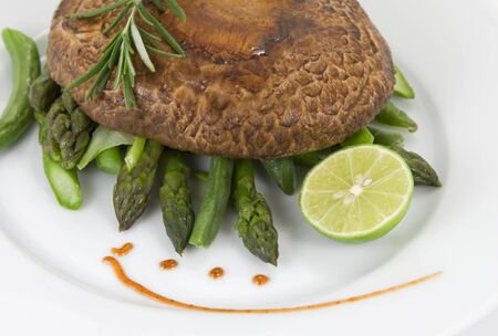 Portobello mushroom with asparatusの写真素材