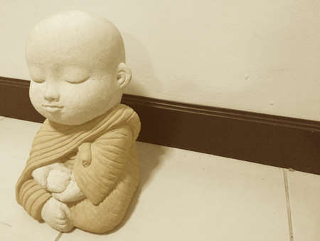 Little Buddha is sitting for meditation.の素材